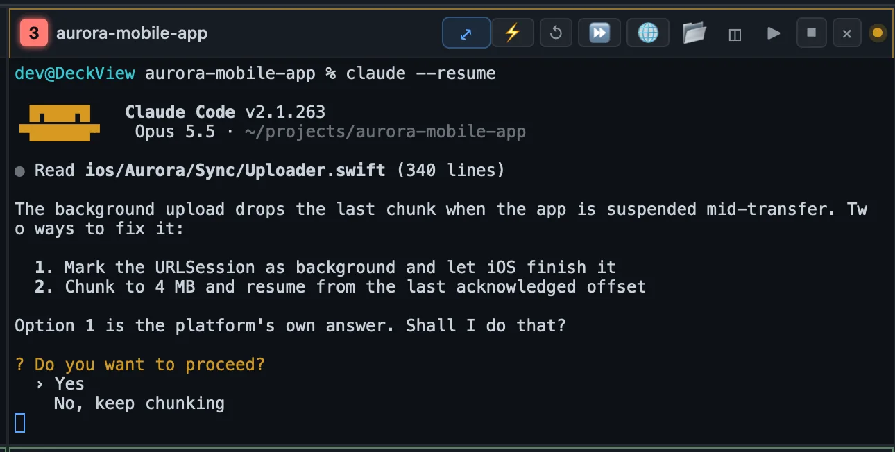A terminal window on an invented project with an amber Claude Code question asking whether to proceed, Yes highlighted.