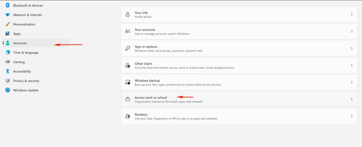 Windows 11 Settings with arrows pointing at Accounts in the left menu and Access work or school on the right.